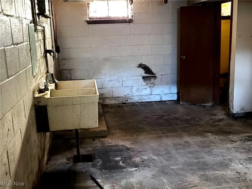 Below grade area with a sink