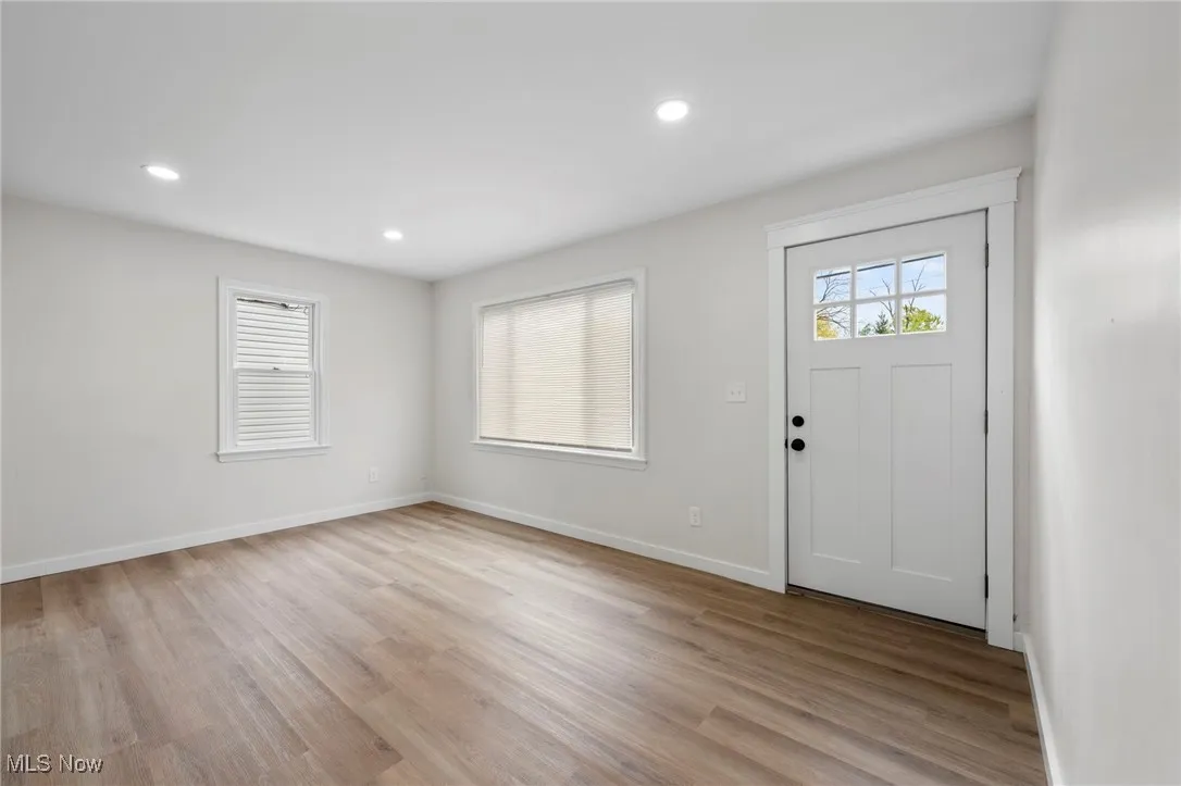 Living room with recessed lighting and LVP floors
