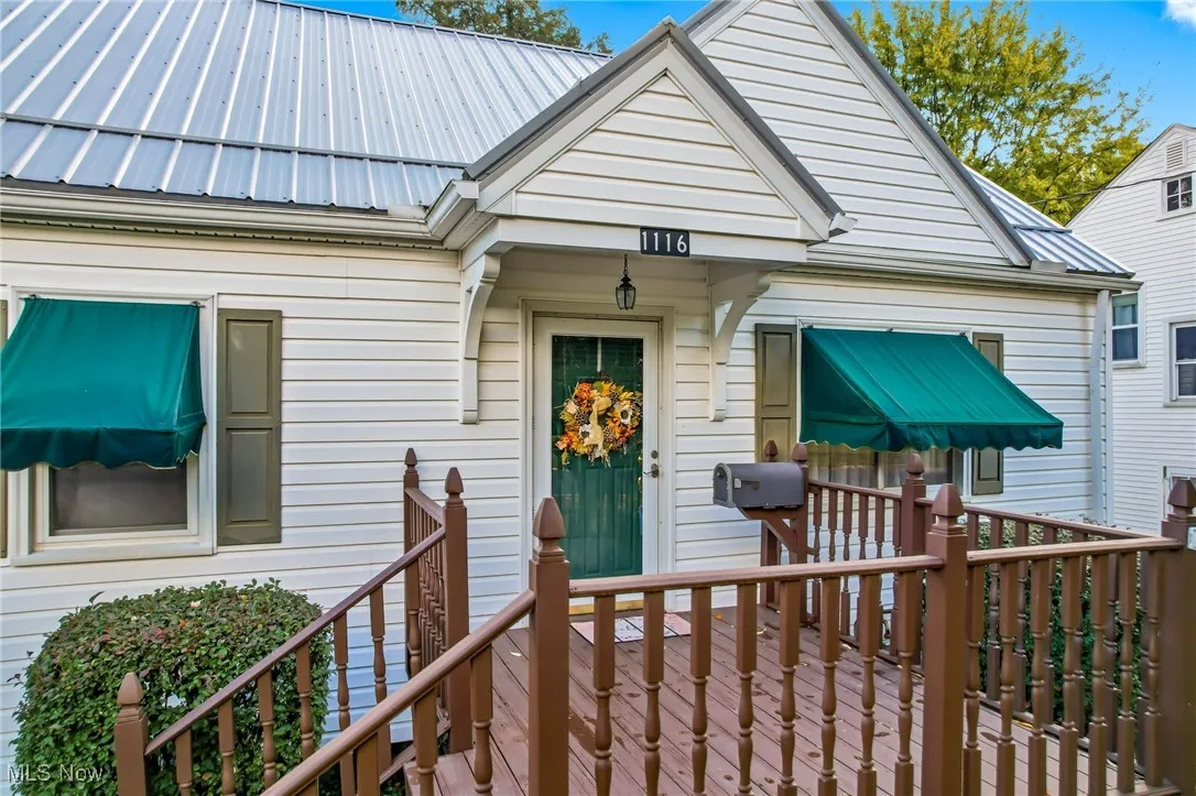 Notice the nice Front porch and widow awnings