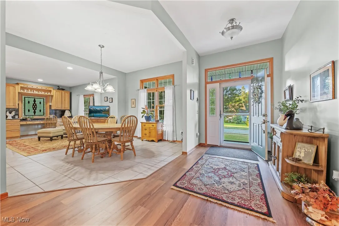 Foyer featuring light wood-style flooring, a chandelier, and recessed lighting