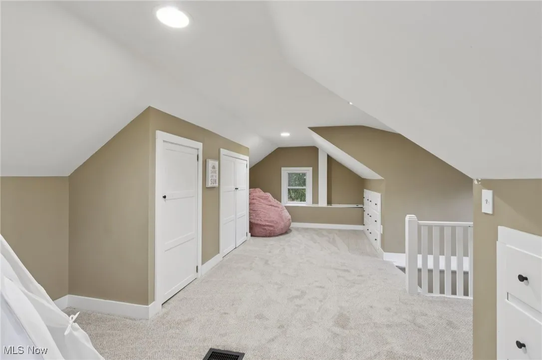 Bonus room featuring carpet flooring, lofted ceiling, and recessed lighting