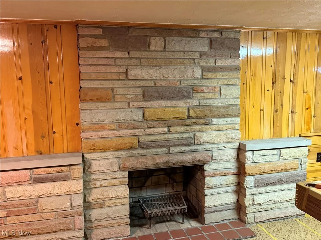 Detailed view of wood walls and a fireplace