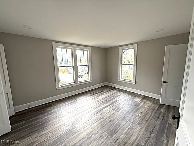 Unfurnished bedroom featuring wood finished floors