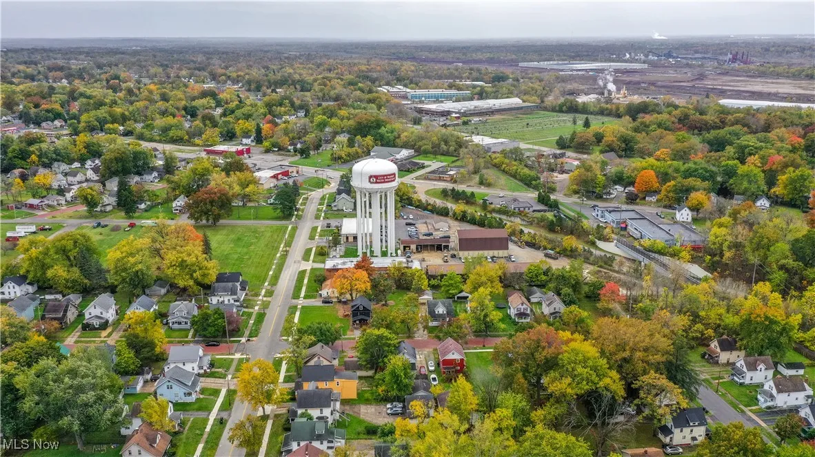 Aerial overview of property's location featuring nearby suburban area
