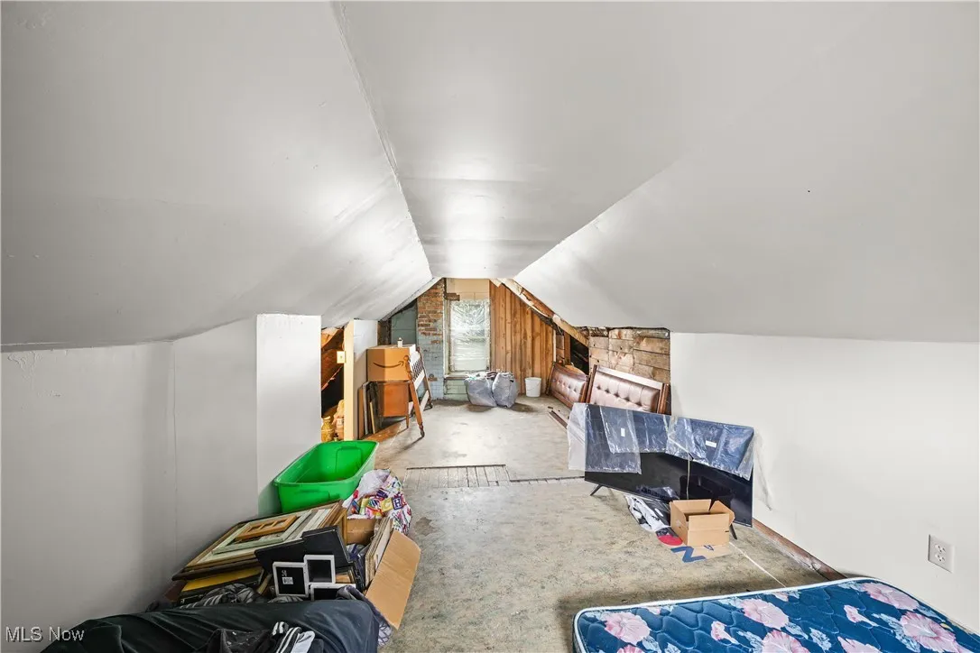 Bedroom featuring vaulted ceiling