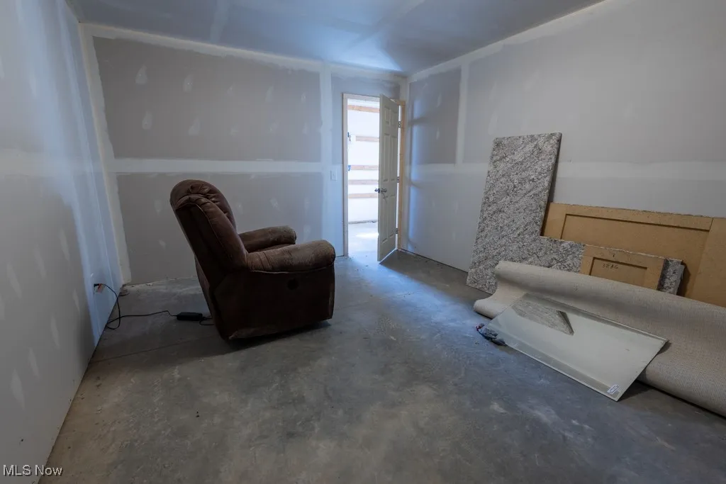 Living area featuring concrete flooring