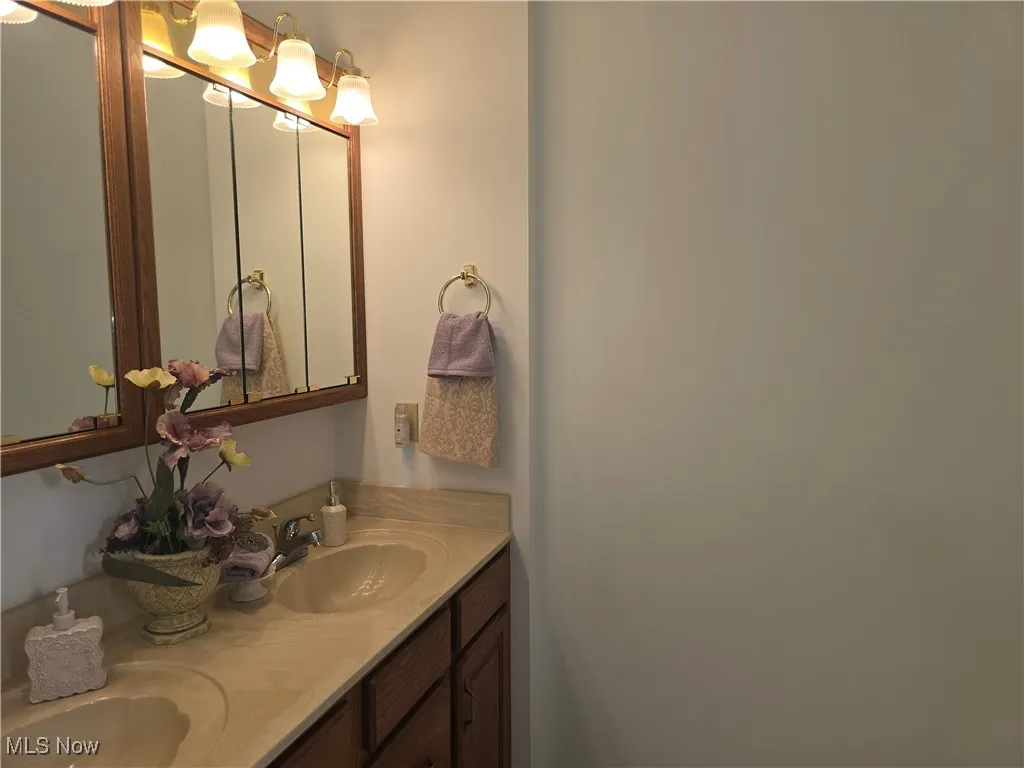 Bathroom featuring double vanity on second floor.
