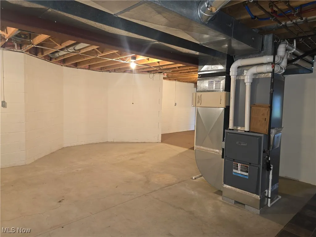 Unfinished basement with heating unit