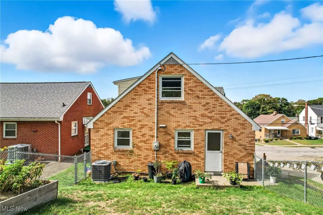 Fenced yard with raised garden bed