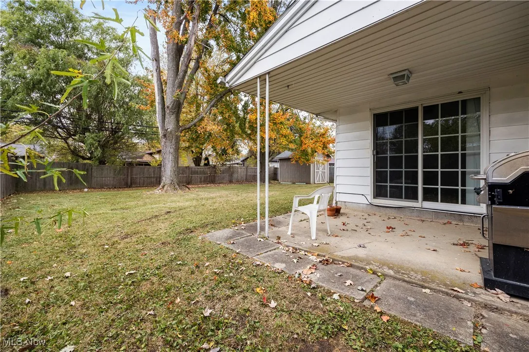 Fenced backyard featuring a patio