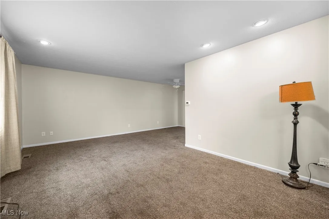 Unfurnished room featuring carpet floors, recessed lighting, and ceiling fan