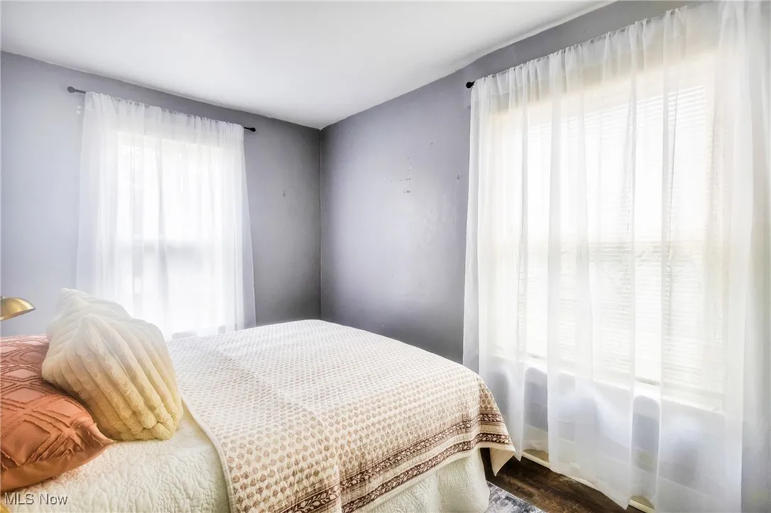Bedroom featuring multiple windows