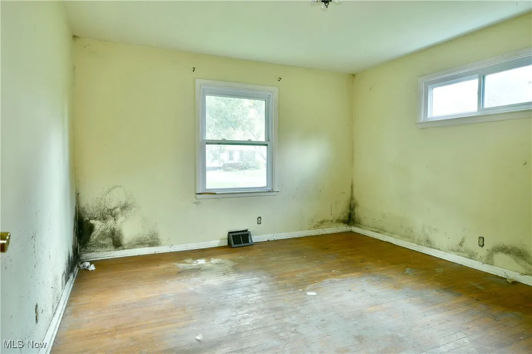 Unfurnished room featuring hardwood / wood-style flooring