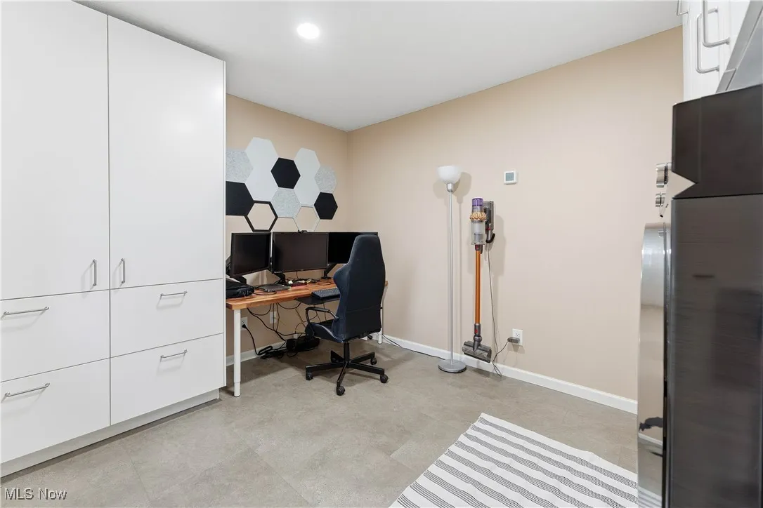 Office space featuring baseboards and recessed lighting