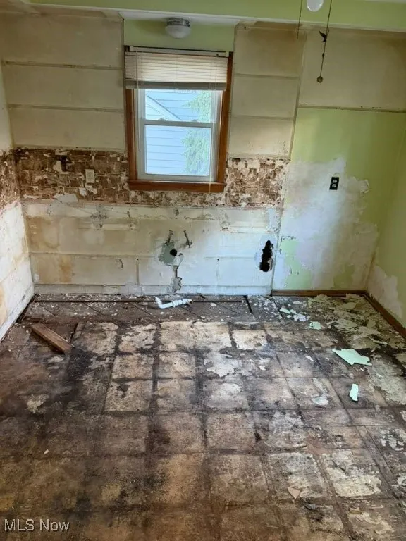 Kitchen featuring brick floors
