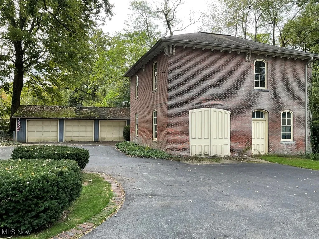 Brick 2 story Carriage house and 3 car heated garage.