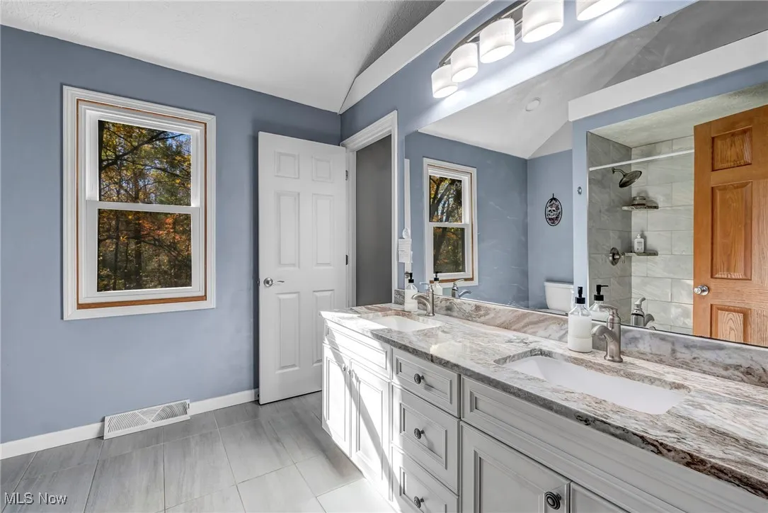 Full bath with tiled shower