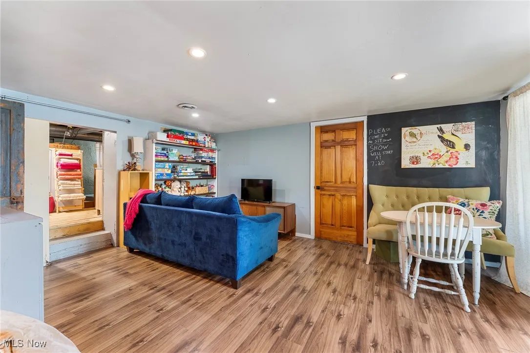 Living area featuring recessed lighting and wood finished floors