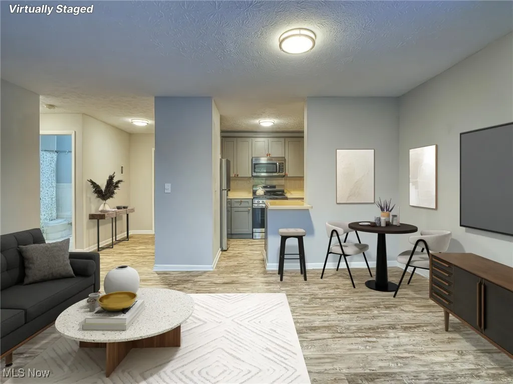 living room with view into dining area and kichen
