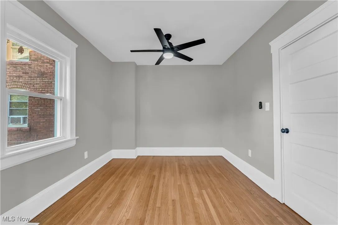 Spare room featuring light wood-style floors and ceiling fan