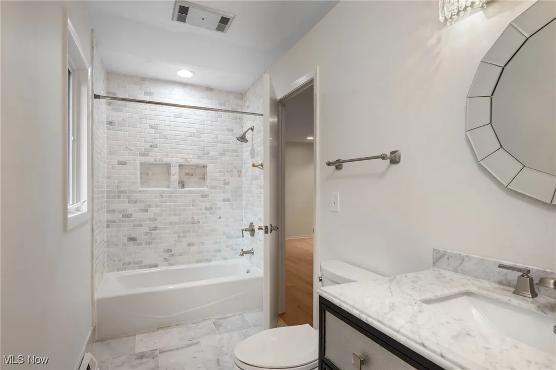 Another full bath serves one bedroom and the bonus room.