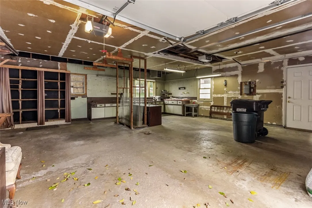 Inside look at garage with workshop and attic space