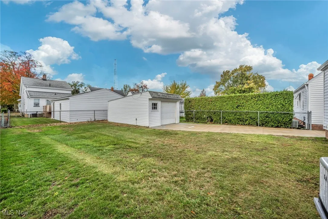 View of yard with an outbuilding