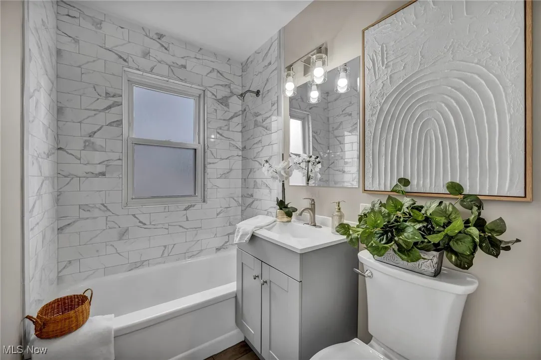 Bathroom featuring vanity and tub / shower combination