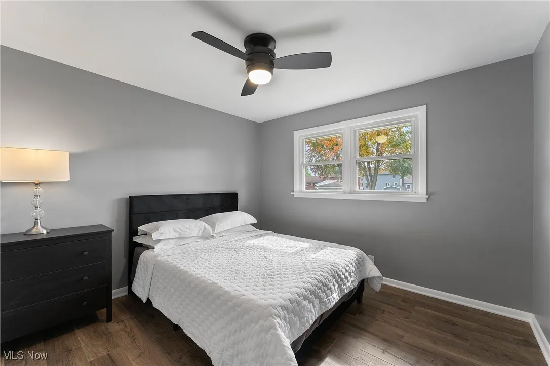 Bedroom 2 with vinyl flooring and ceiling fan