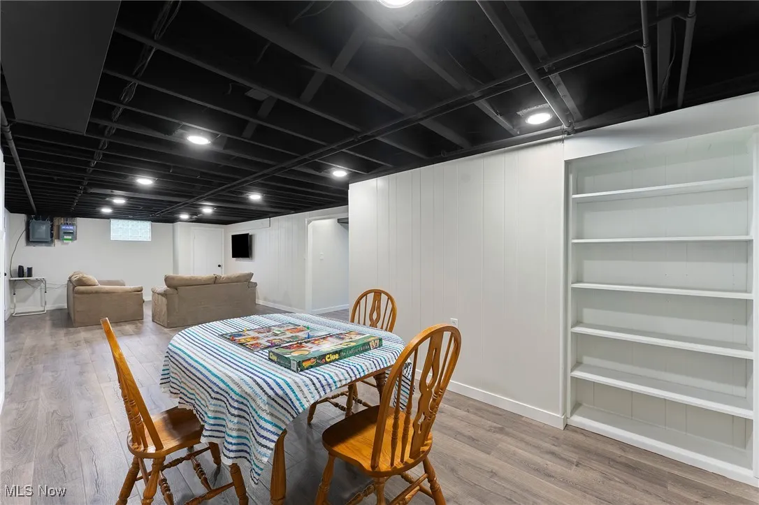 Dining space featuring wood finished floors and baseboards