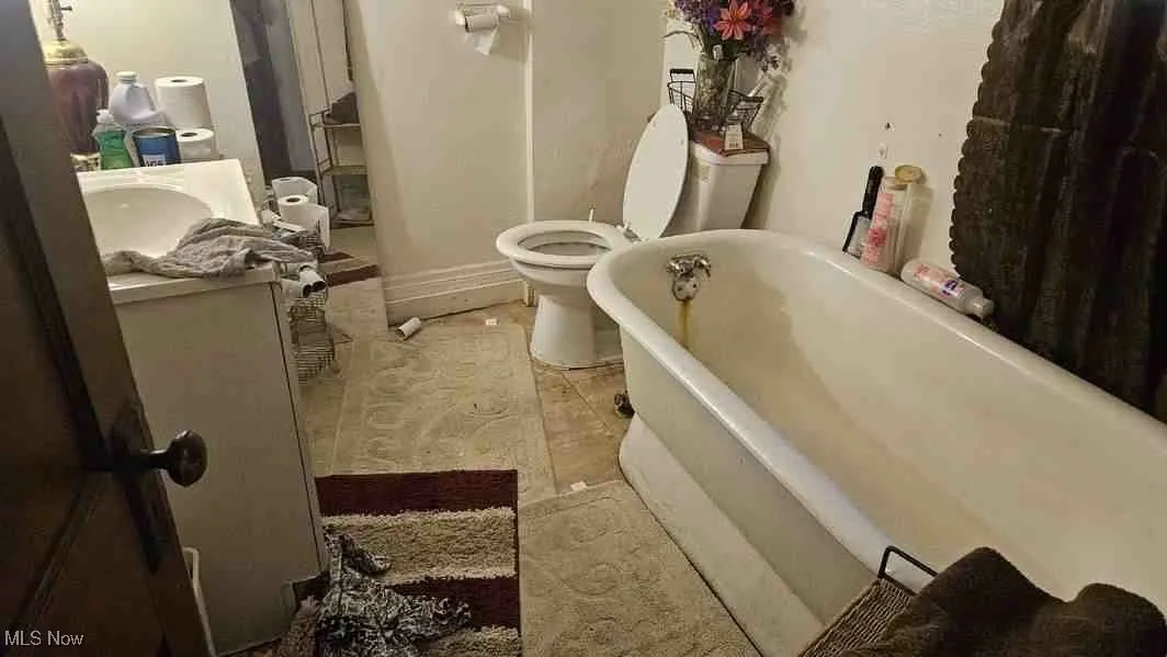Bathroom featuring a freestanding bath and vanity