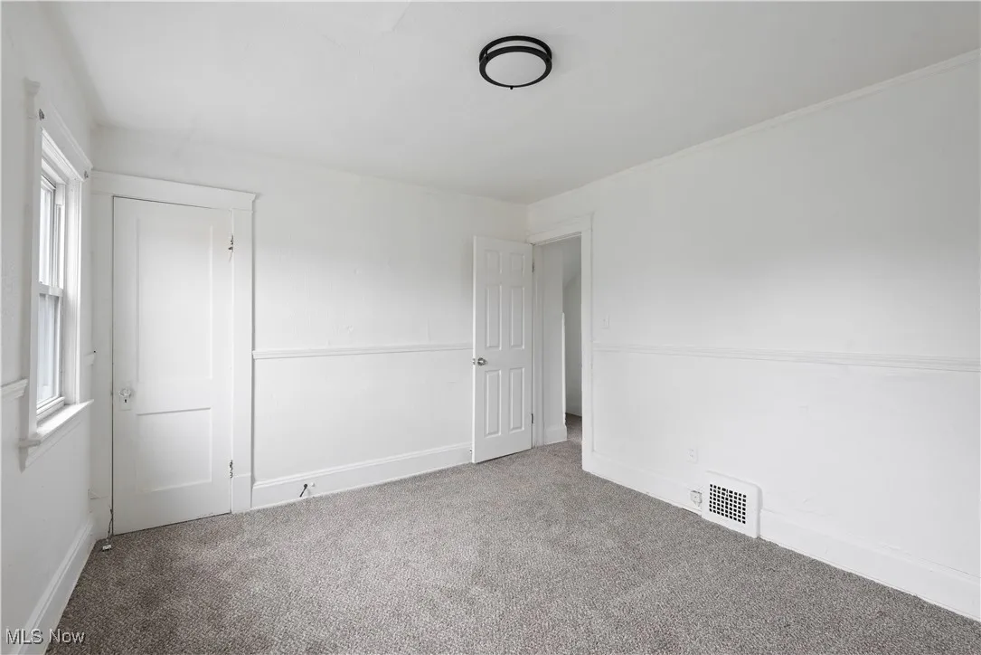 Unfurnished bedroom featuring carpet floors