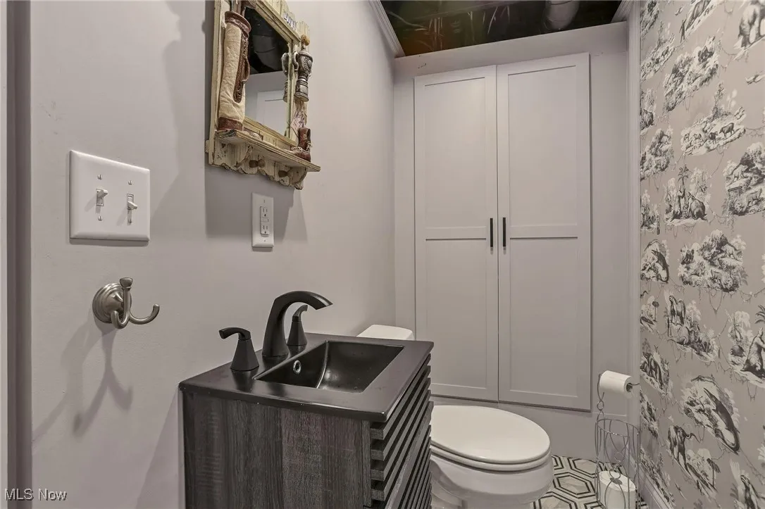 Bathroom featuring vanity and toilet