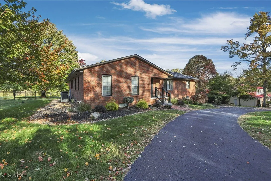 View of front of property featuring brick siding