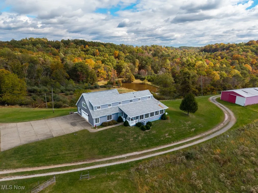 View from above of property with a forest