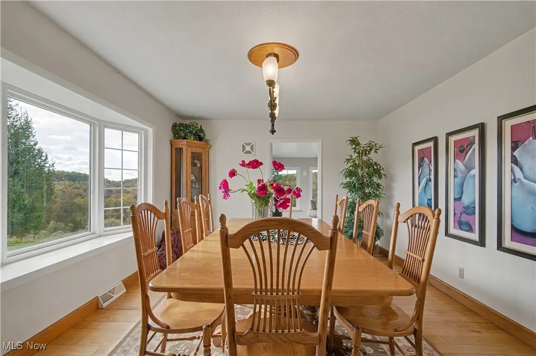 Dining space with light wood-style flooring