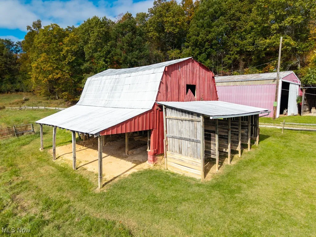 View of barn with a yard