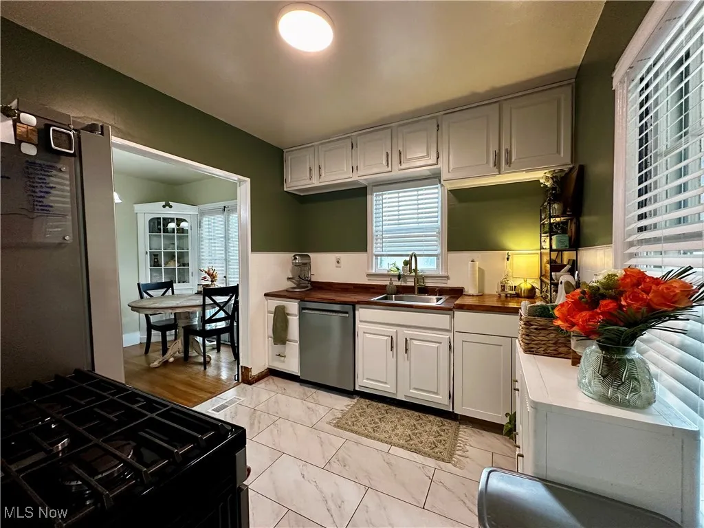 View of the kitchen and dining room from the side, carport entry.