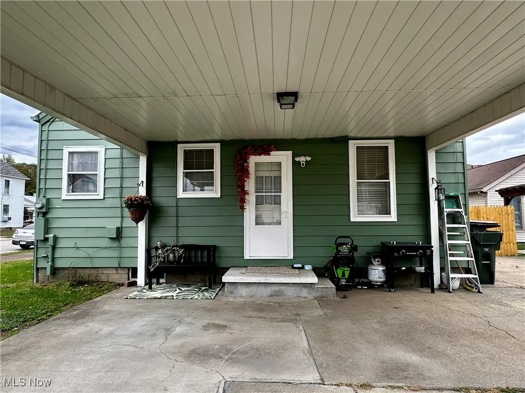View of exterior entry and carport