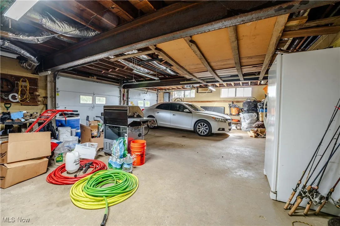 Garage with freestanding refrigerator