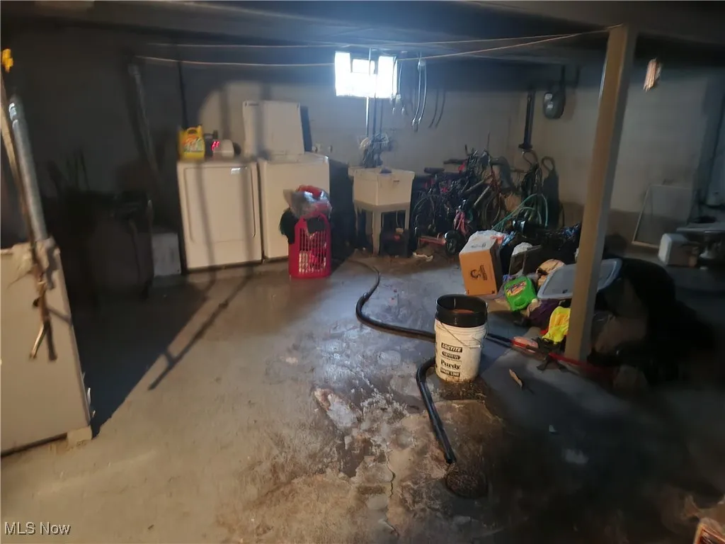 Basement with washer and clothes dryer