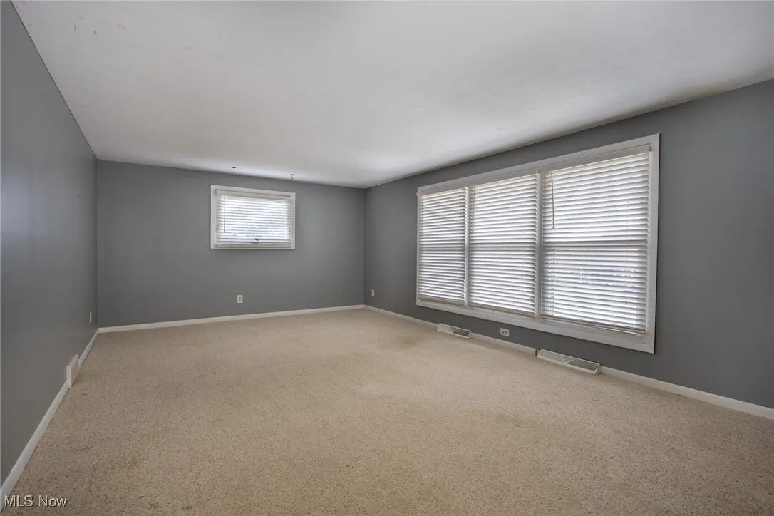 Spare room with carpet flooring and baseboards