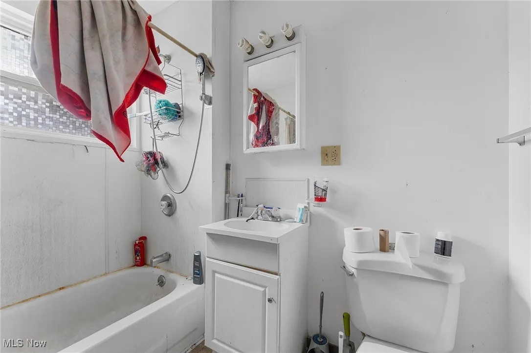 Bathroom with shower / tub combination and vanity