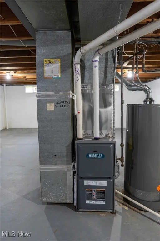 Utility room with water heater and heating unit