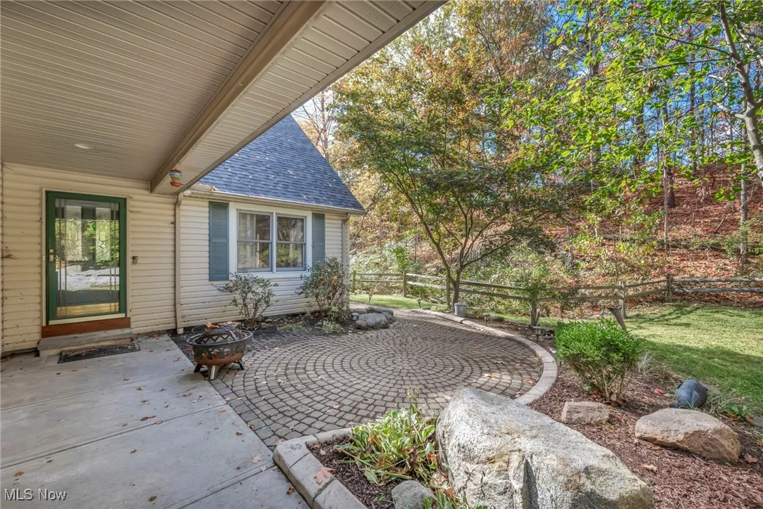 View of patio featuring an outdoor fire pit