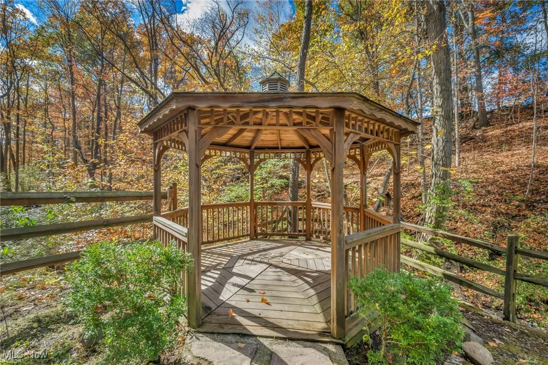 Wooden deck featuring a gazebo