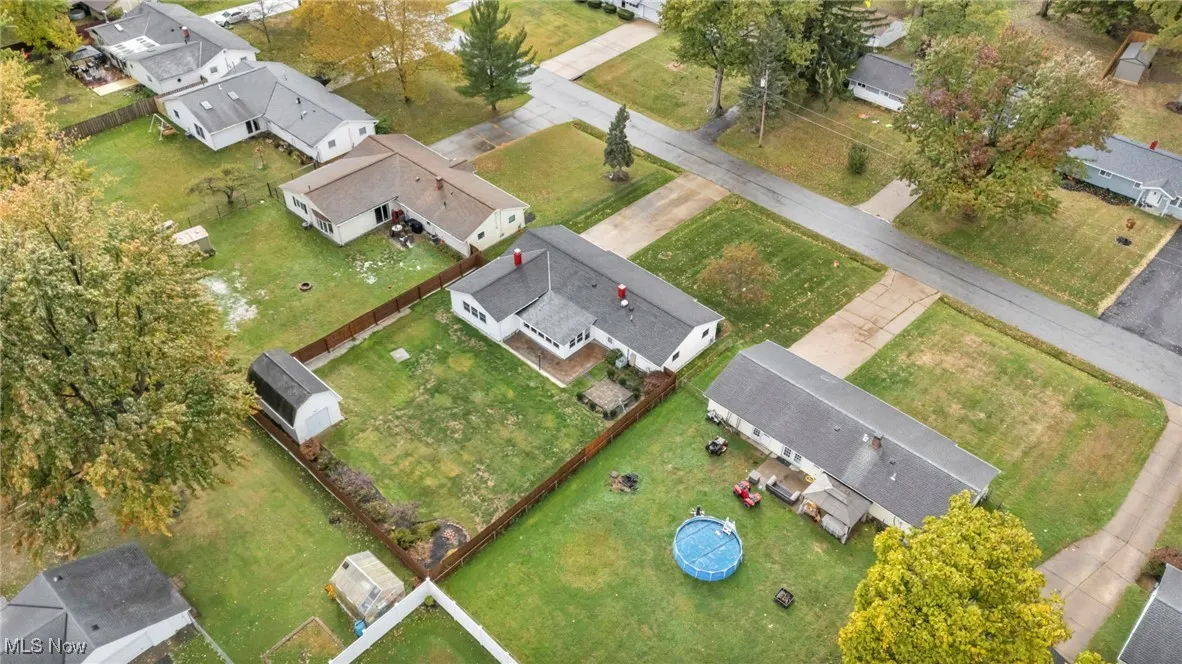 Aerial overview of property's location featuring nearby suburban area