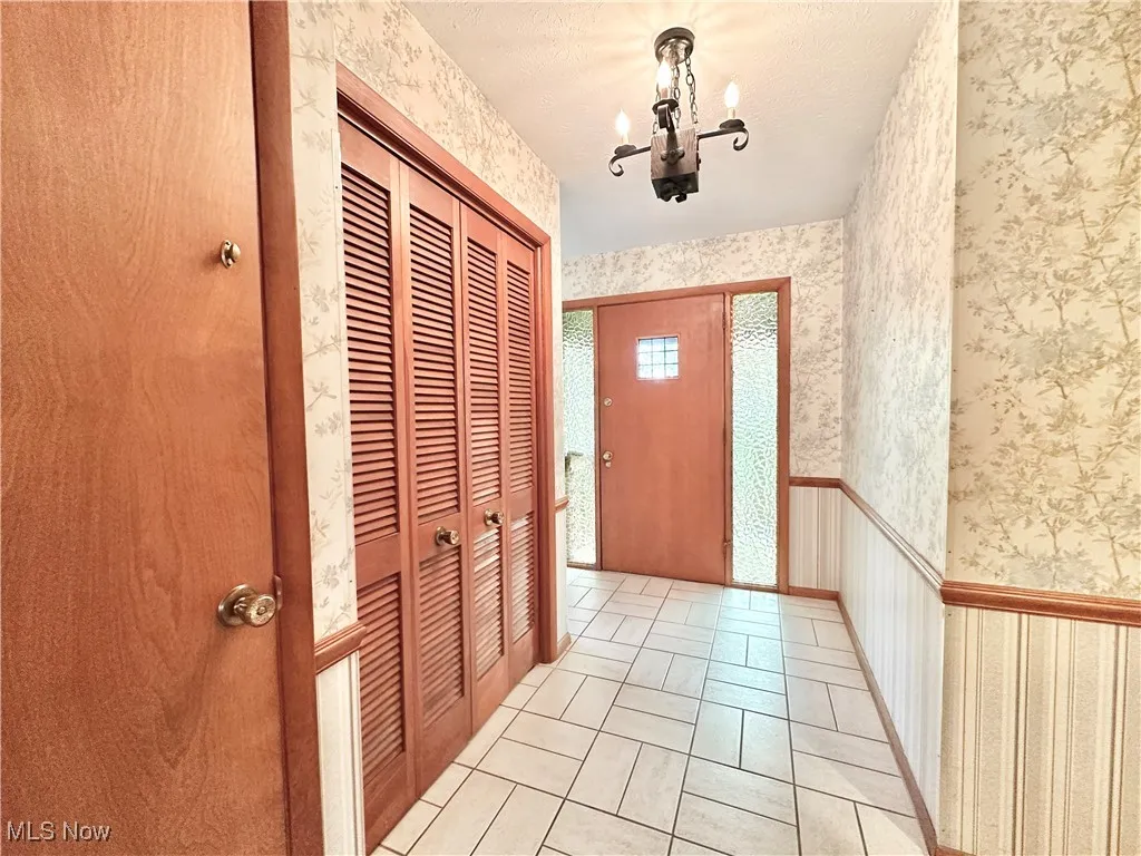 Foyer and walkway to kitchen