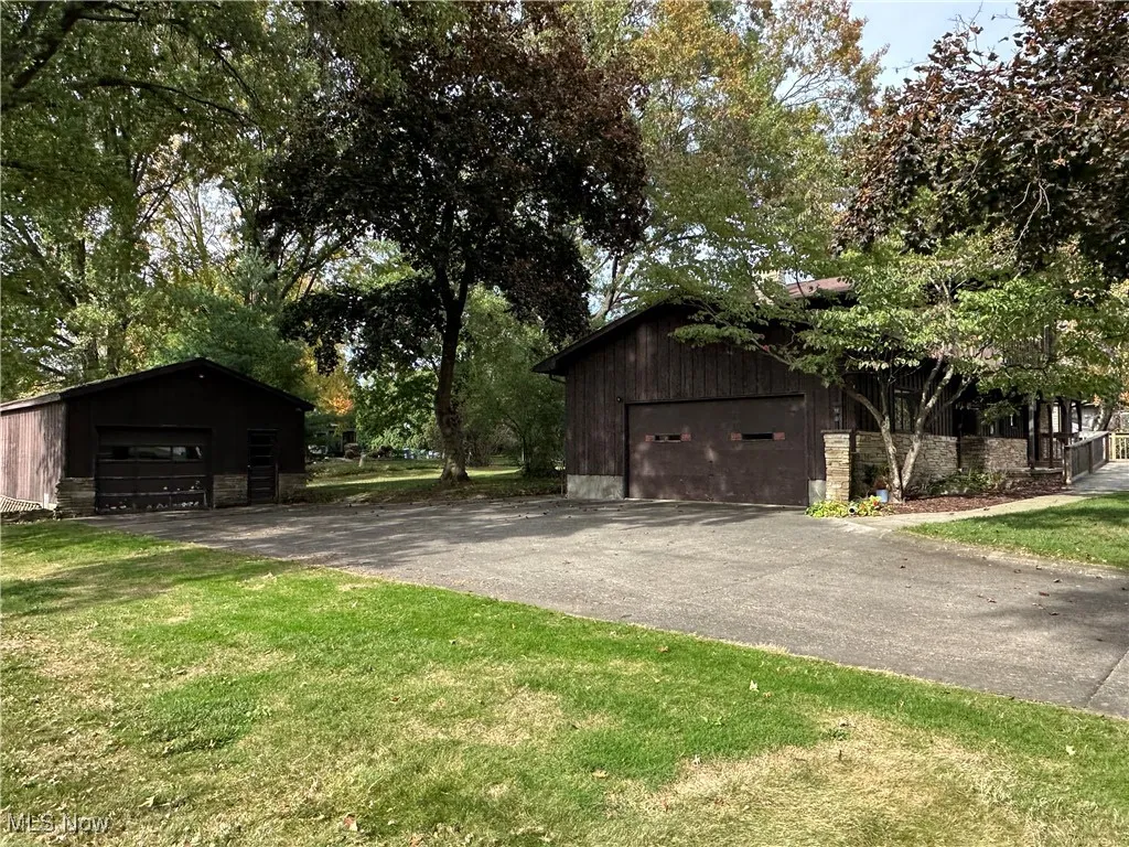 Side view including both garages