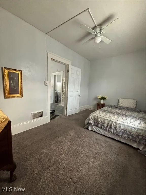 Bedroom with carpet and a ceiling fan